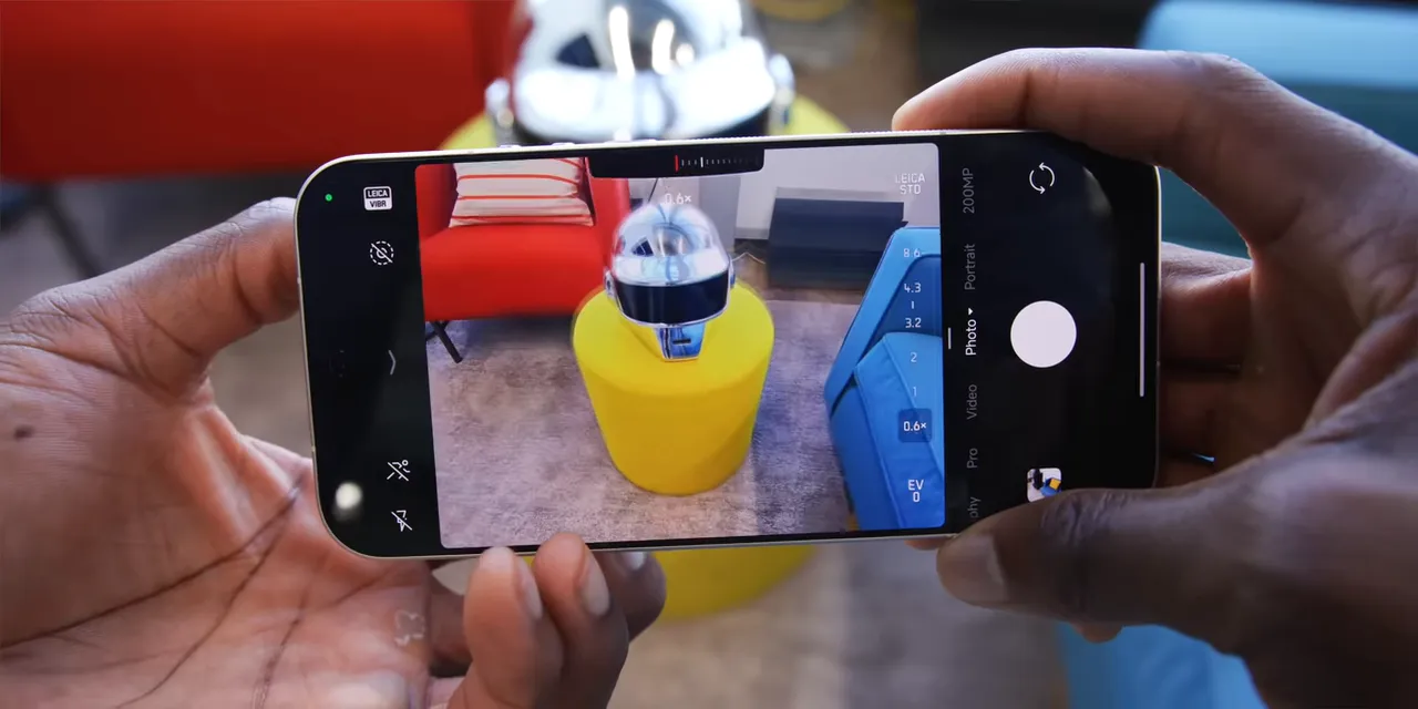 Phone camera preview showing a finger obscuring the lower portion of an ultrawide scene
