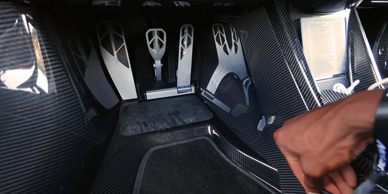 McLaren W1 pedal assembly and adjustment lever inside the carbon-fiber footwell