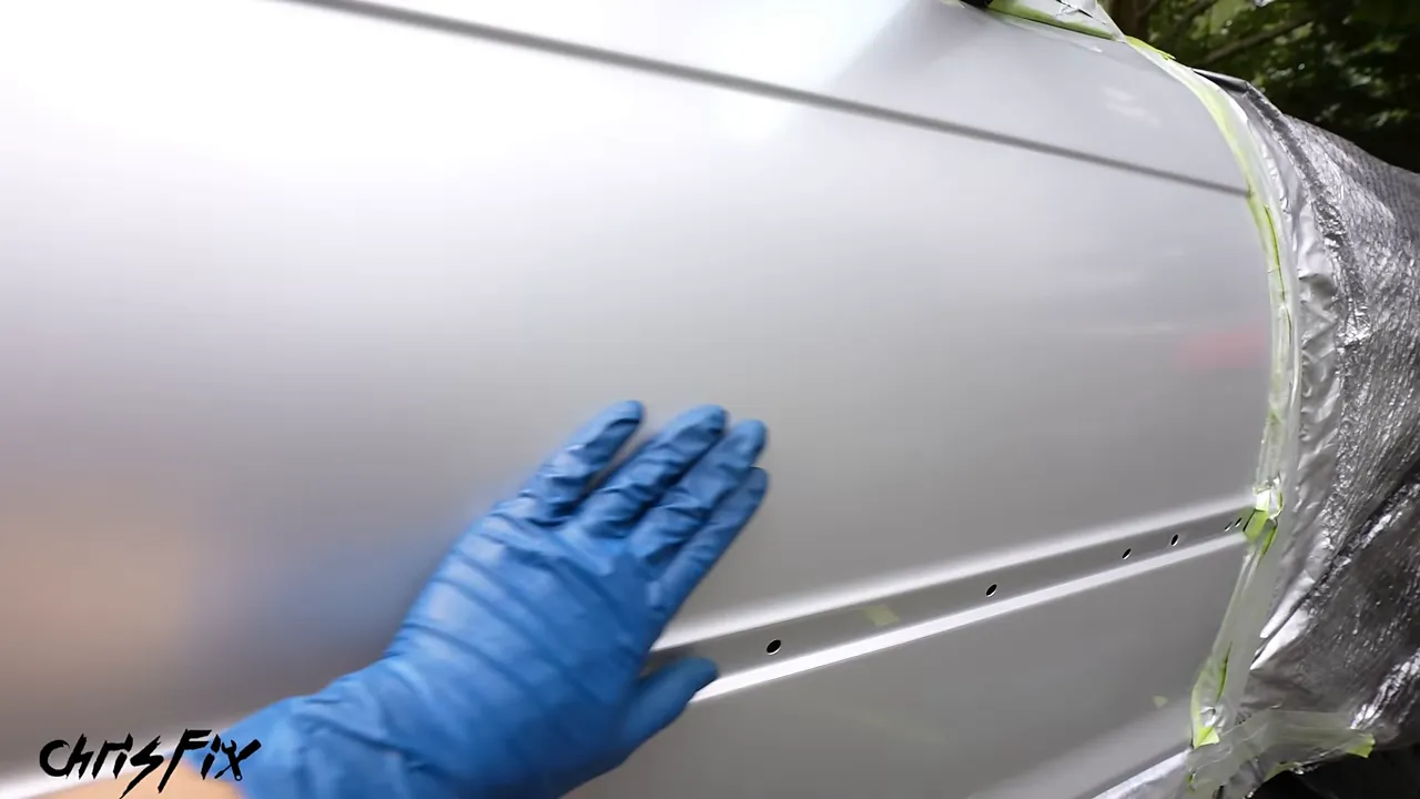 Silver door with a dull uniform surface after wet sanding