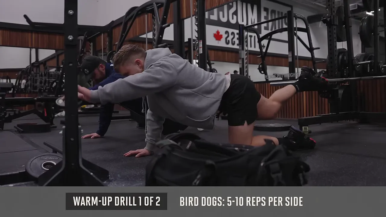 Jeff extending one arm and the opposite leg from a hands-and-knees position
