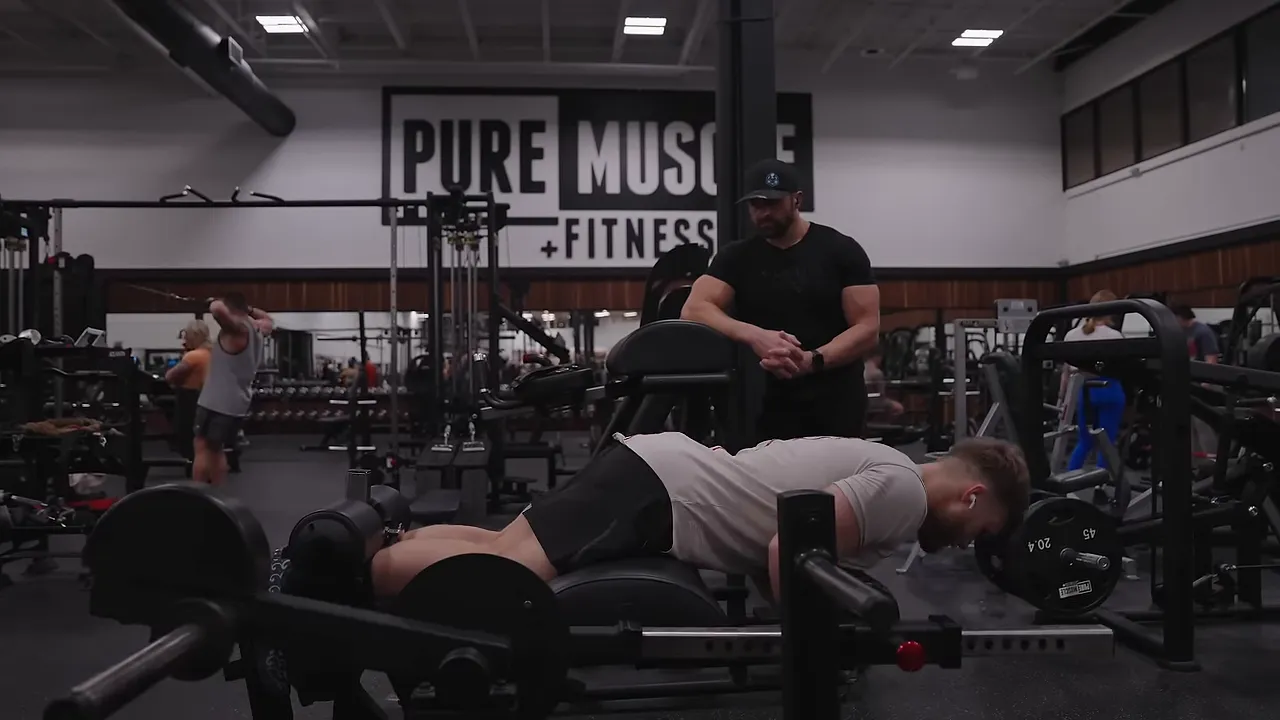 Jeff lowered forward on a glute-ham raise machine with his ankles secured behind him