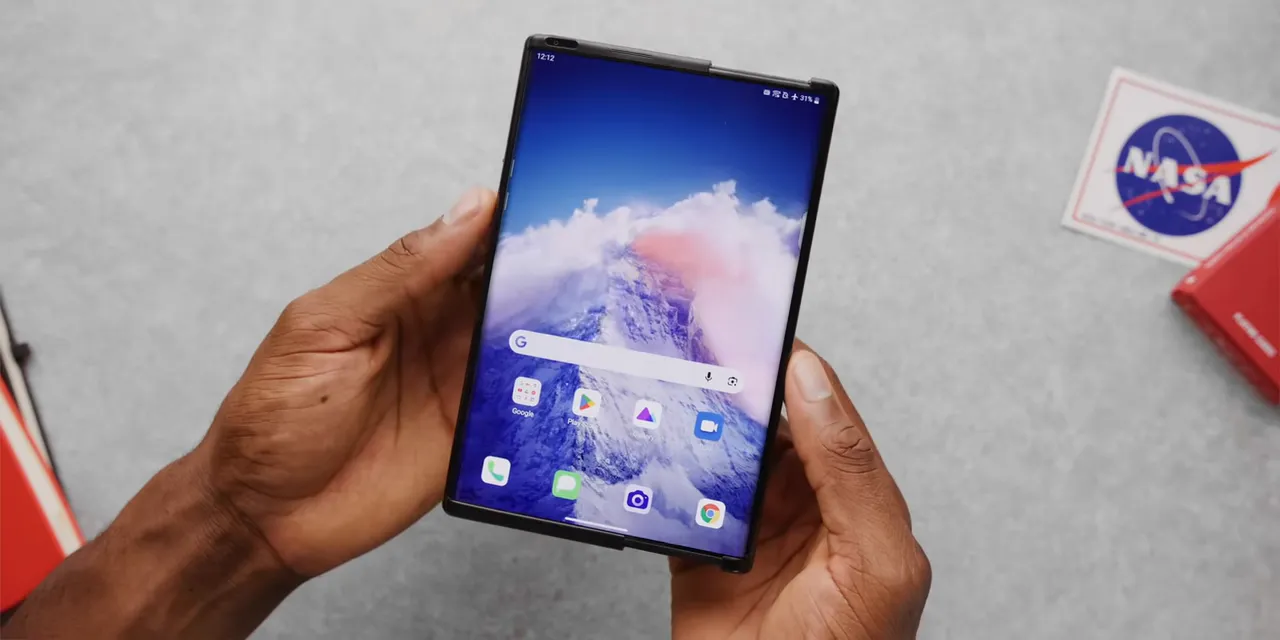 Expanded LG rollable phone showing a wide home screen with a wave wallpaper