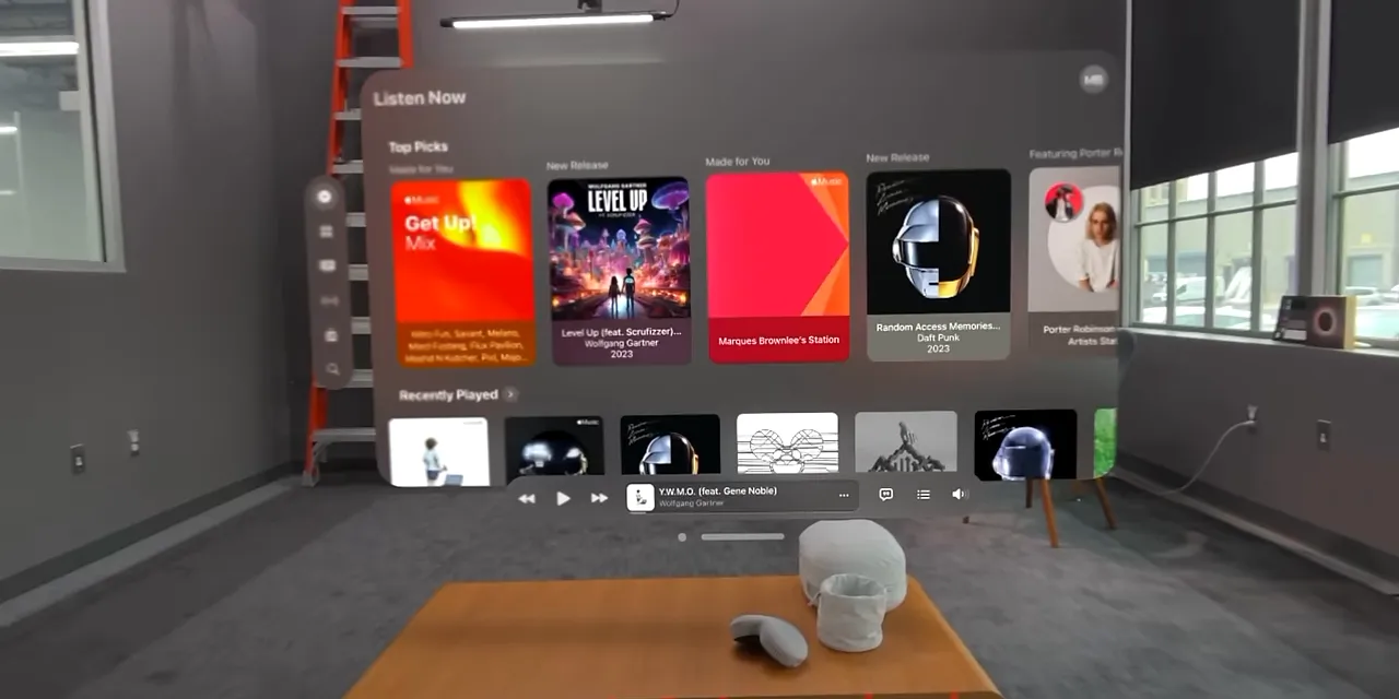 Apple Music window floating above a coffee table in the visionOS room view