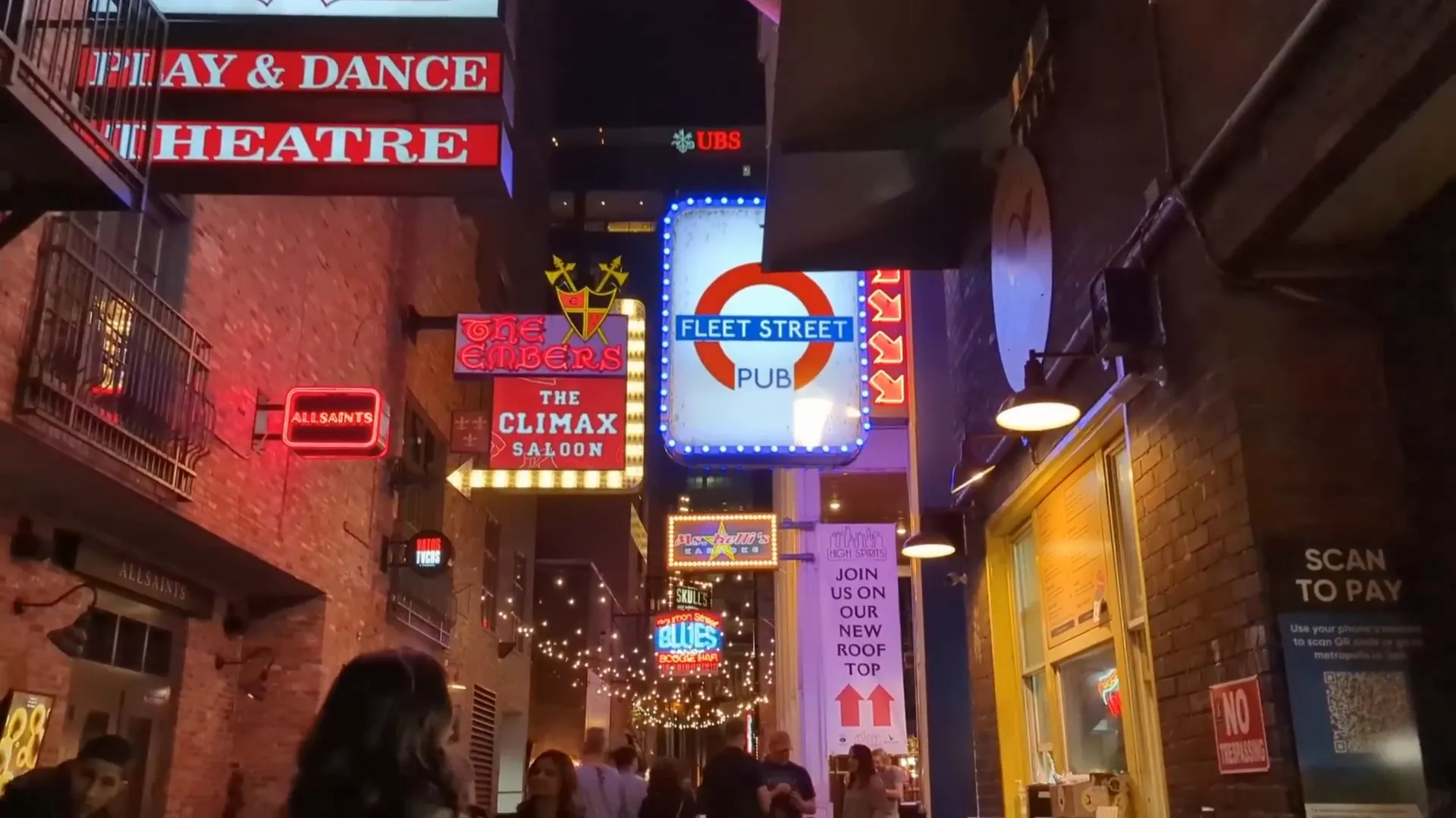 The magical atmosphere of Printer's Alley with neon lights