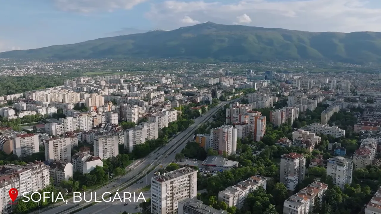 High-resolution aerial panorama of Sofia, Bulgaria with dense residential blocks, main road and Vitosha mountain behind
