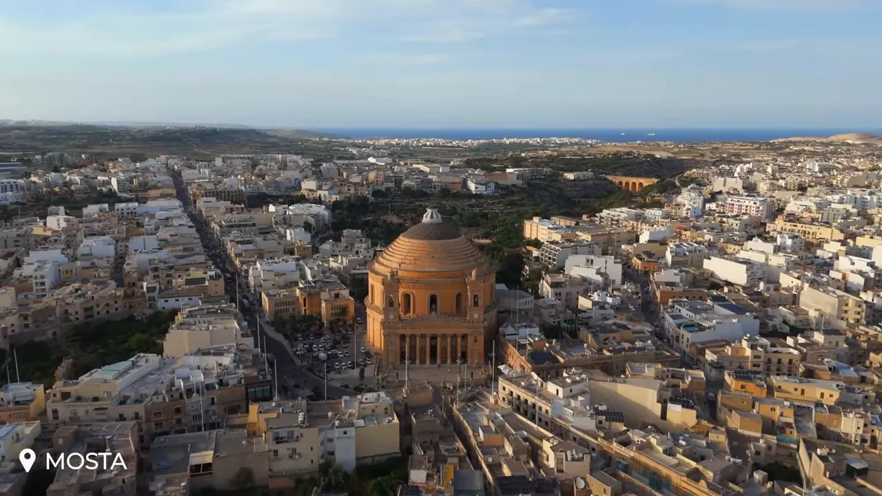 Aerial view of the Mosta Rotunda (Church of St Mary) with its large dome and surrounding town