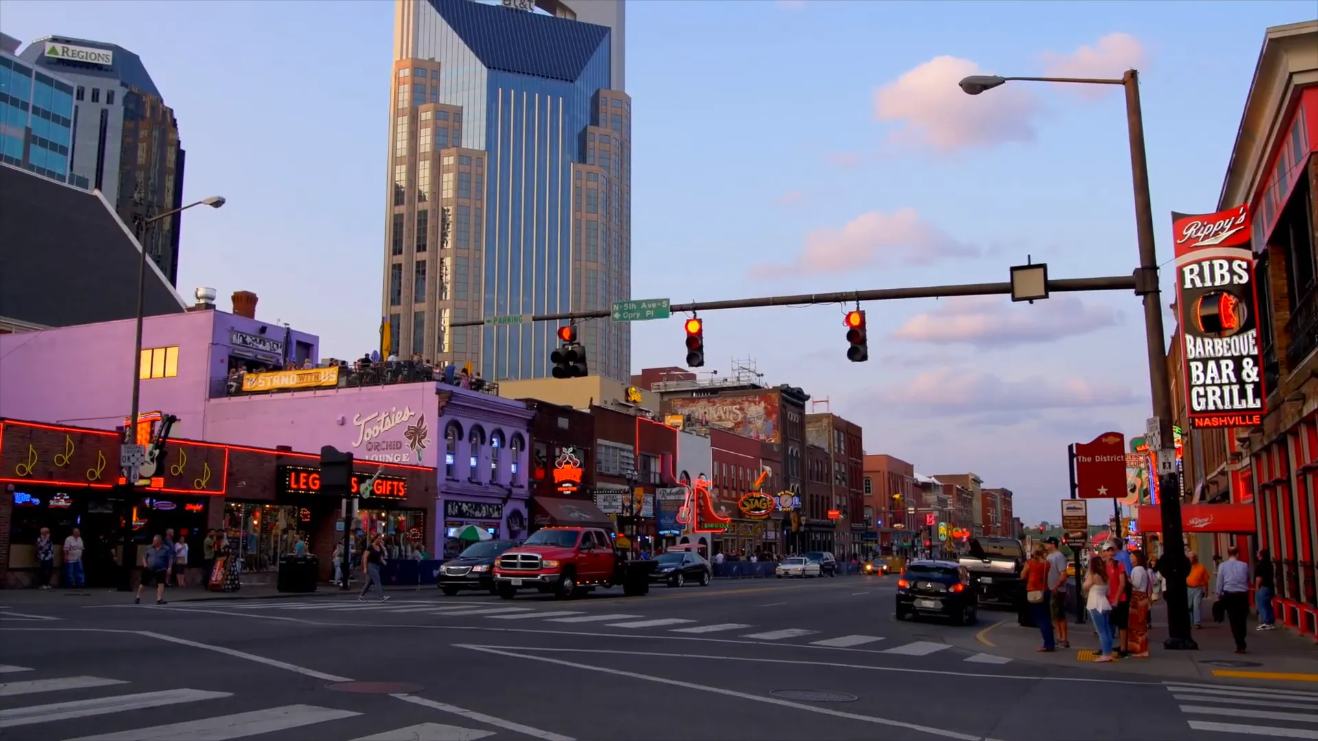 Crowded Broadway with visitors walking and planning
