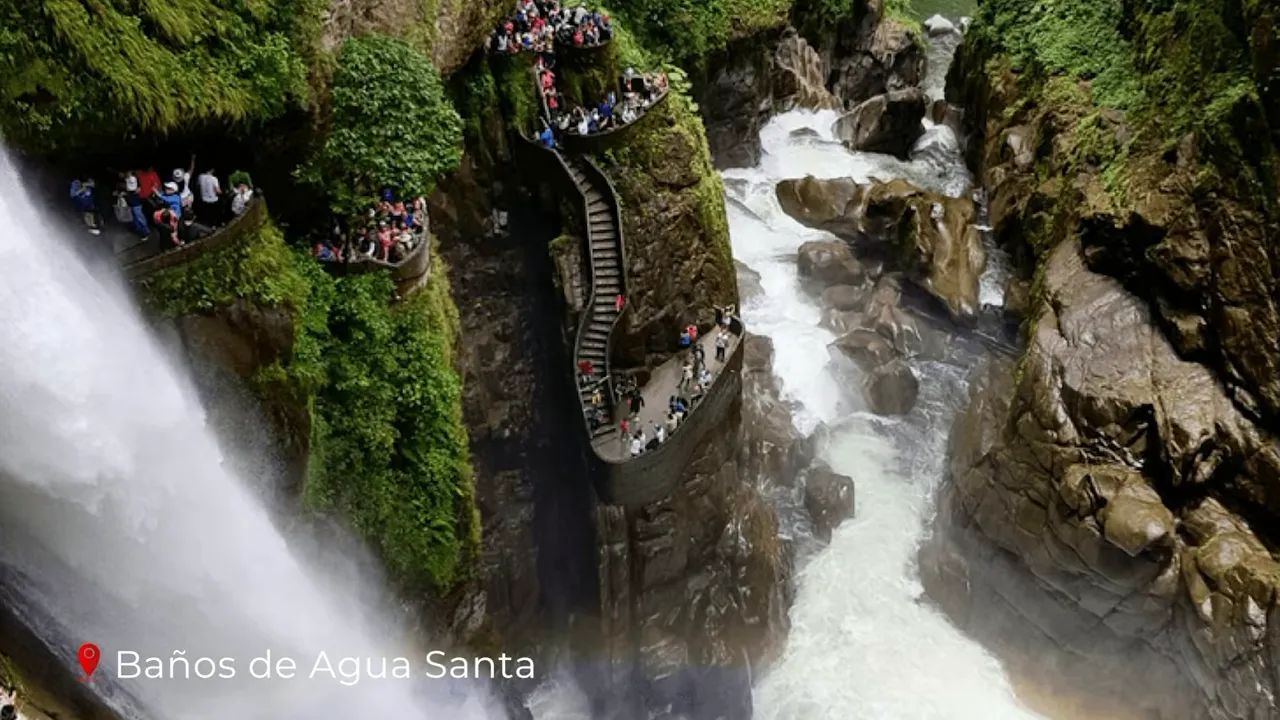 Visitors on the stepped viewing platforms at Pailón del Diablo waterfall in Baños de Agua Santa, with the powerful cascade and river below