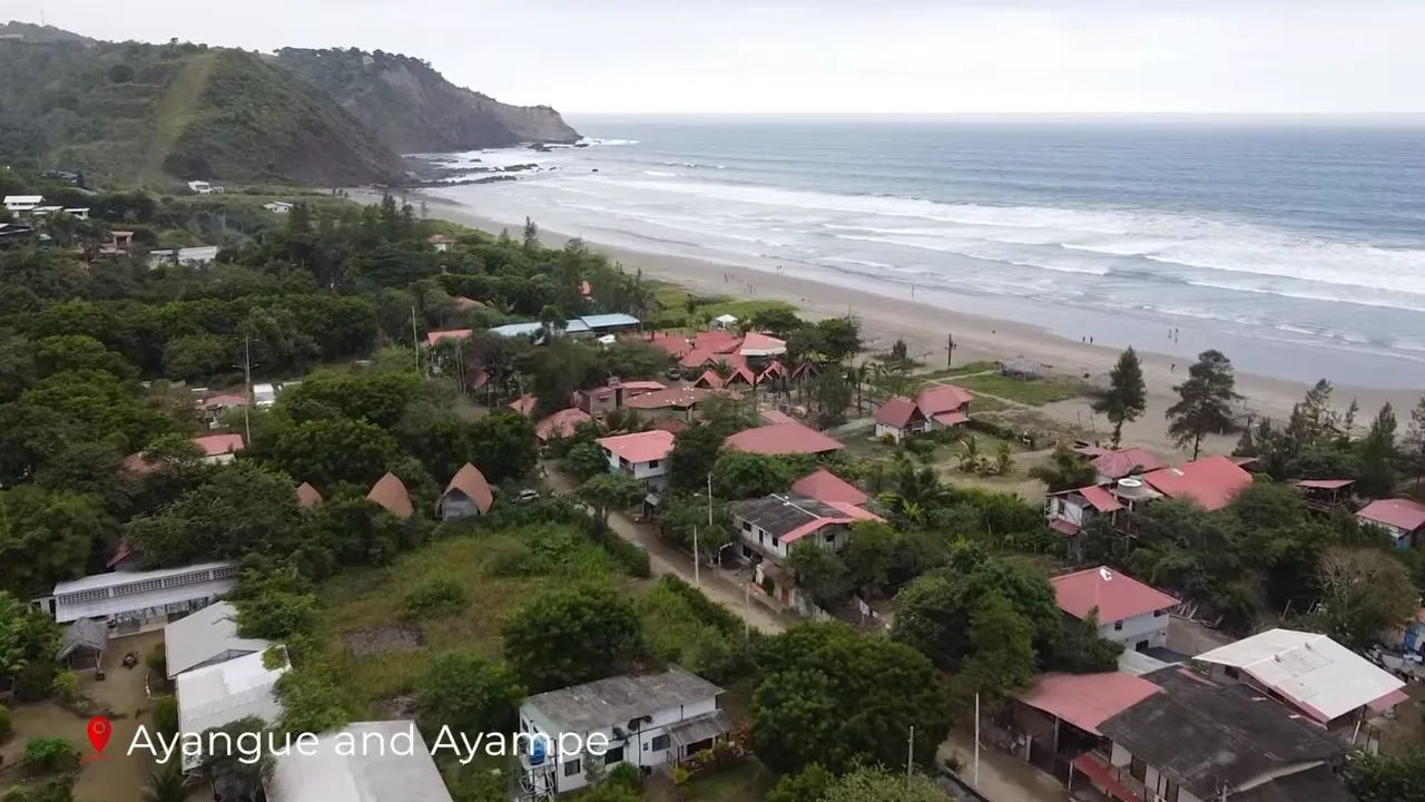 Aerial view of Ayangue and Ayampe coastline with sandy bay, red-roofed village and rolling Pacific surf