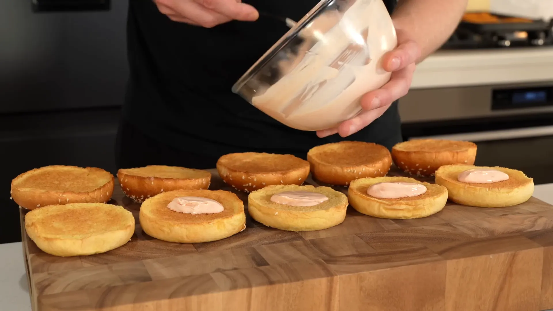 Assembling the crispy chicken burgers