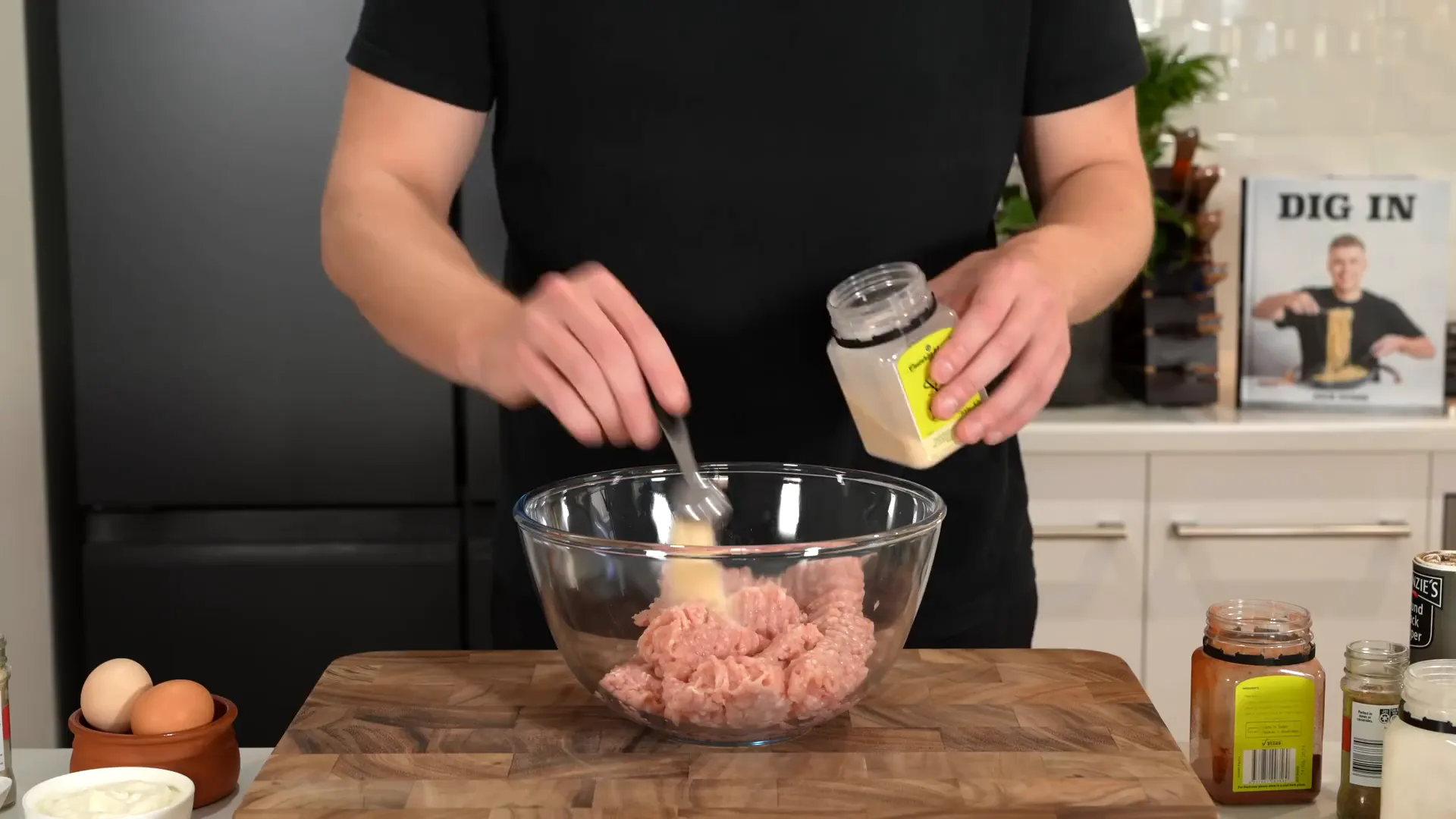 Mixing chicken mince with spices