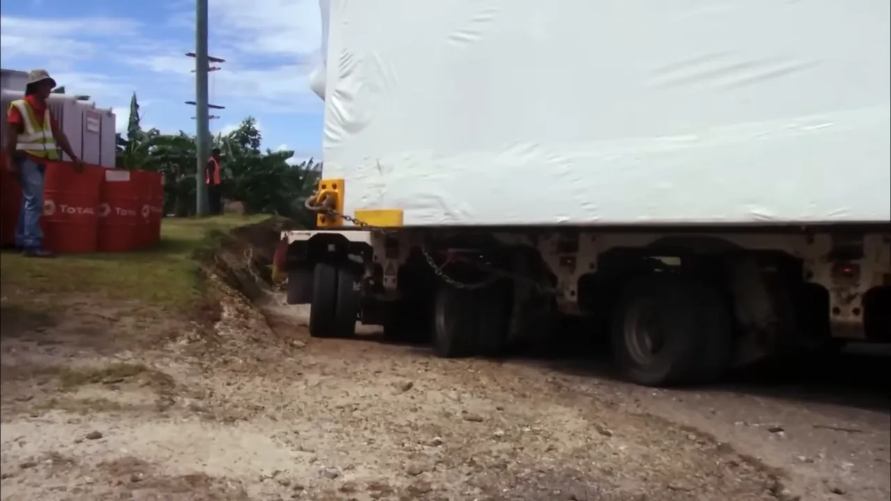 Massive switchroom trailer negotiating island terrain