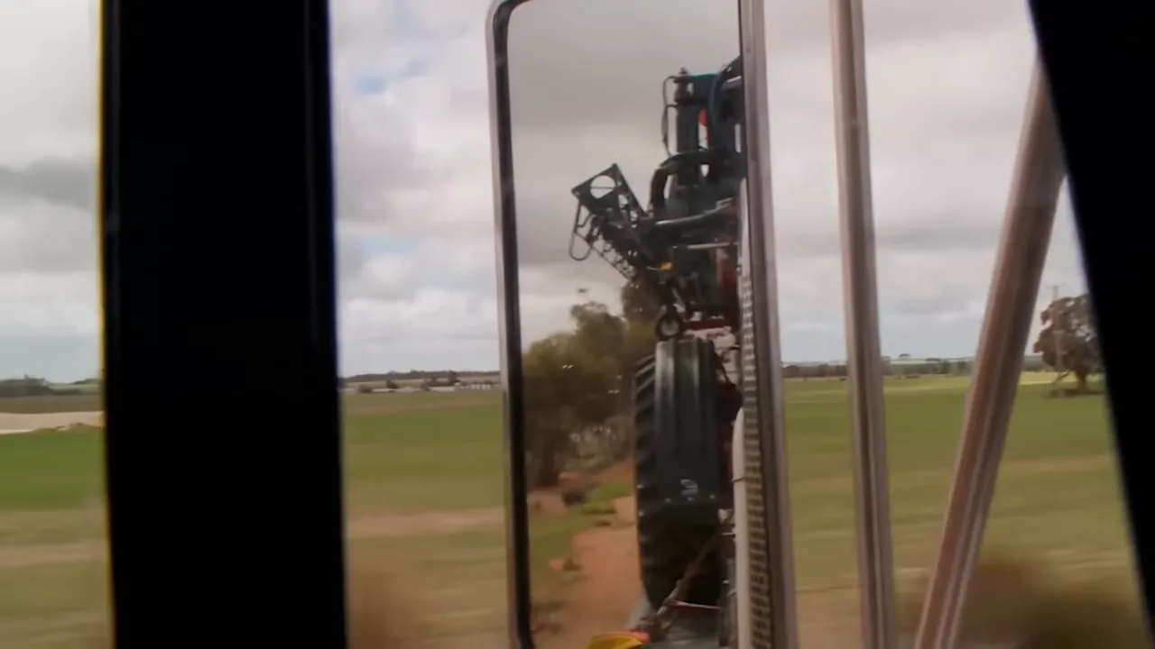 High machinery on the trailer swaying in crosswind