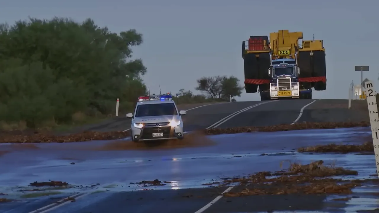 Floodway with tree debris after overnight rain
