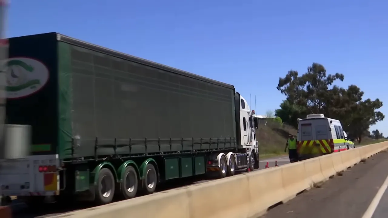 Truck pulled into inspection bay for checks