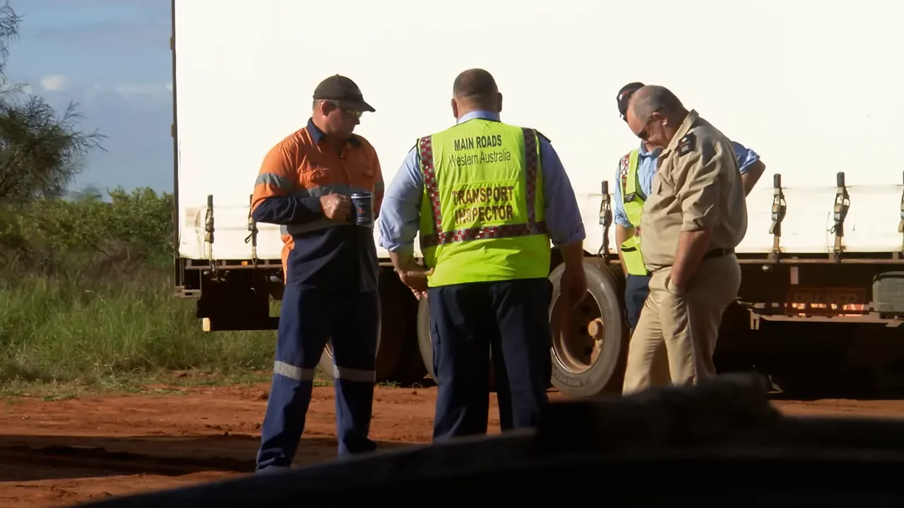 Transport inspectors checking paperwork at Dampier