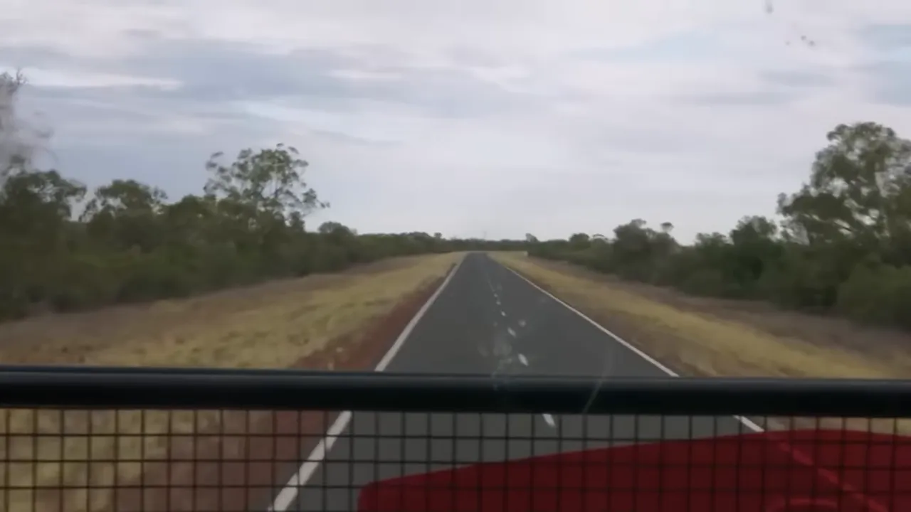 Nigel checking mirrors and gauges while on the highway