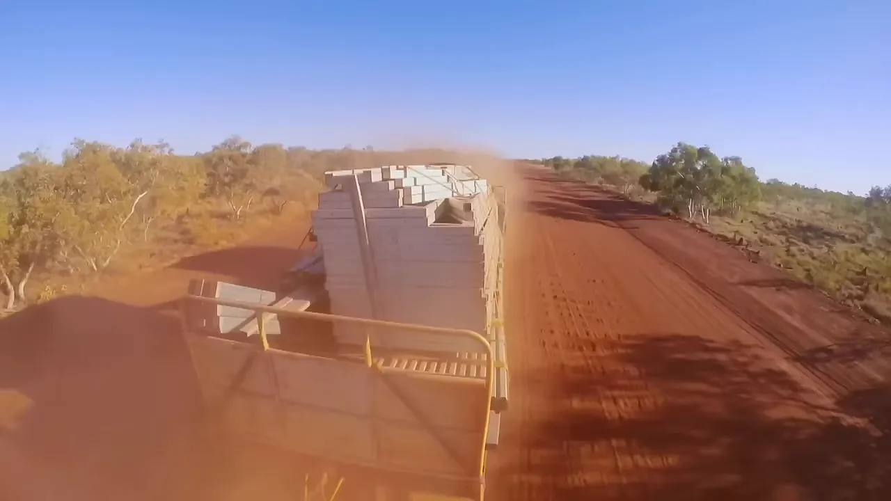 Johnny fighting for traction, crawling out of sand with diff lock on