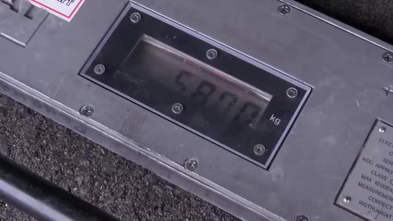 Truck on the weighbridge showing the overweight result