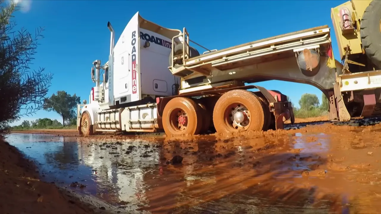 Si's truck bogged in the mud