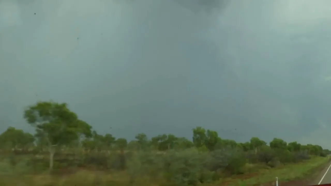 Heavy storm blowing across the outback—strong winds and rain
