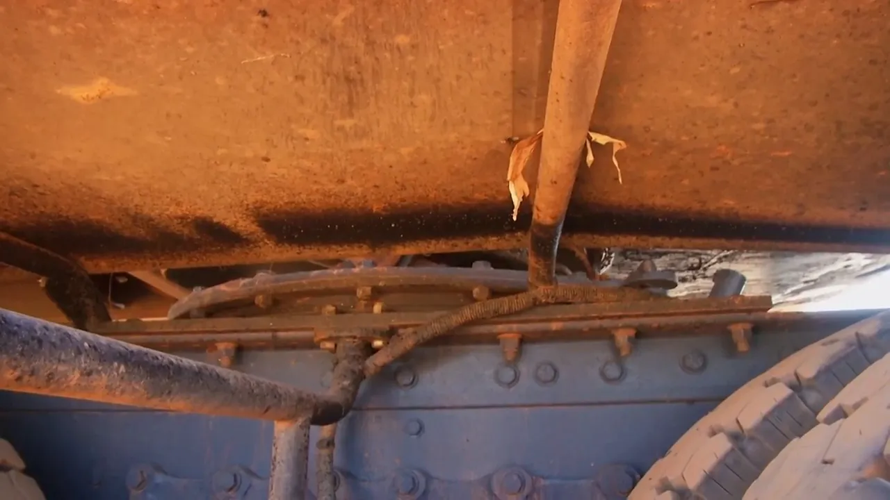Close-up showing oil spray from a failed wheel seal