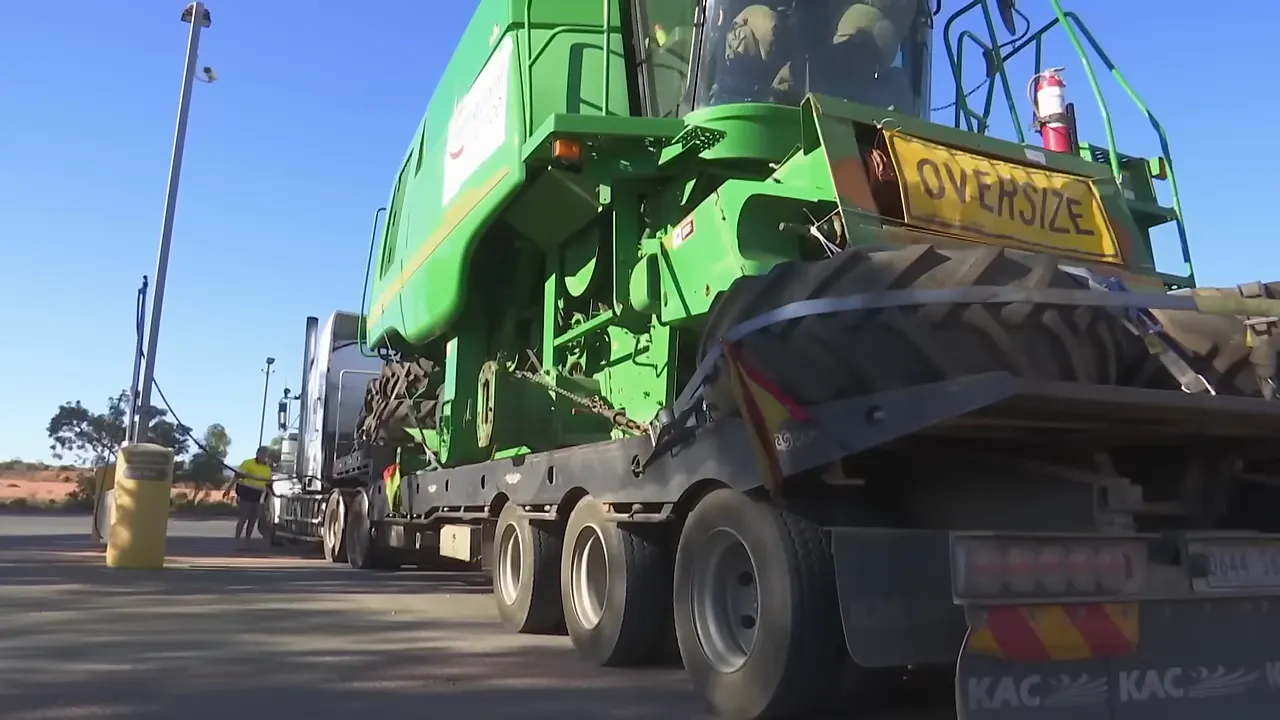The 30-tonne combine harvester strapped to the trailer
