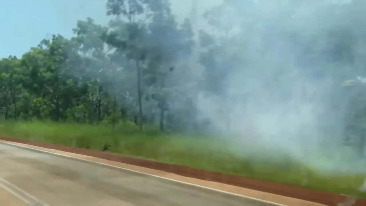 Hazy sky and smoke from bushfires seen near the road