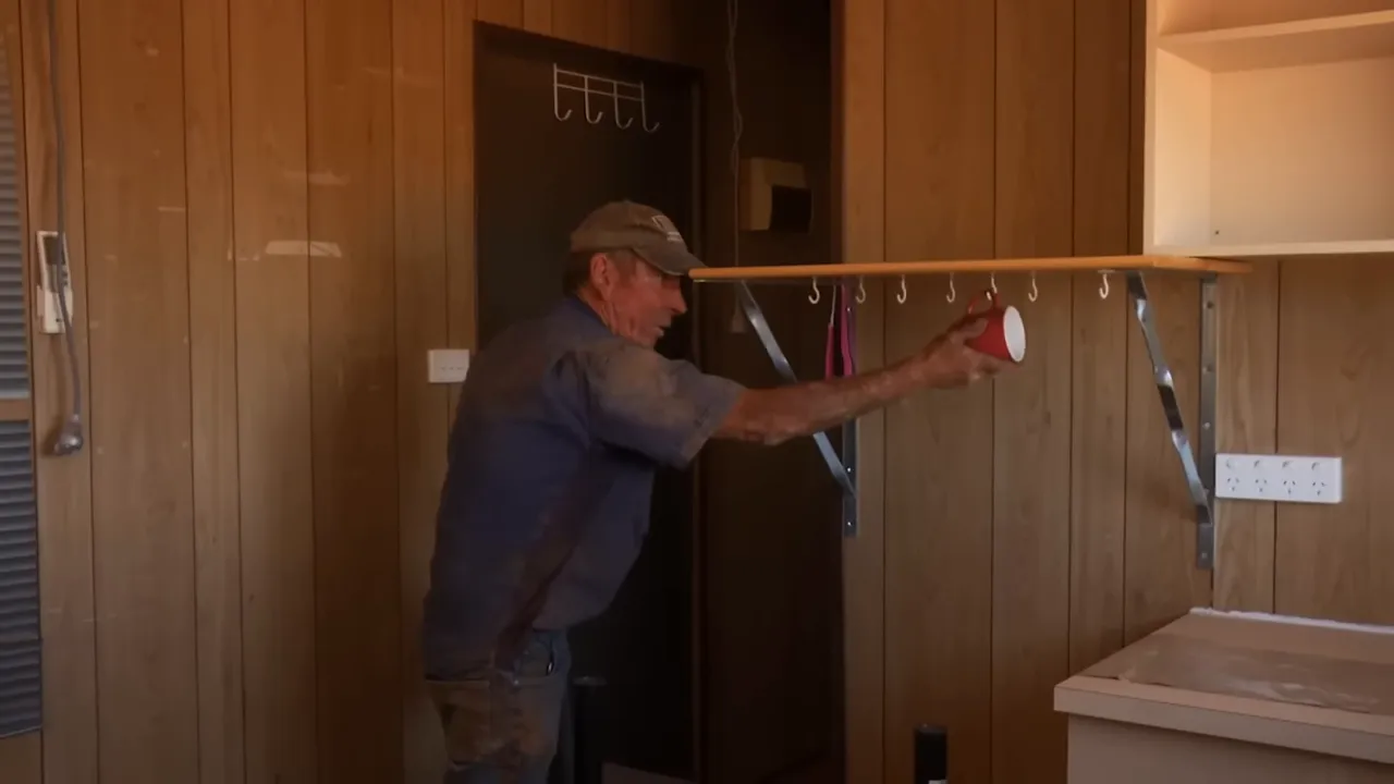 Russell checks the hut's cup after rough road