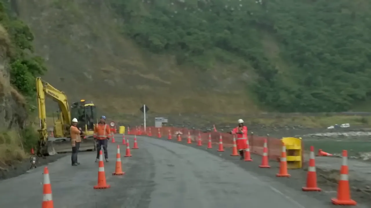 Coastal road damaged after the 2016 earthquake, banks held with containers