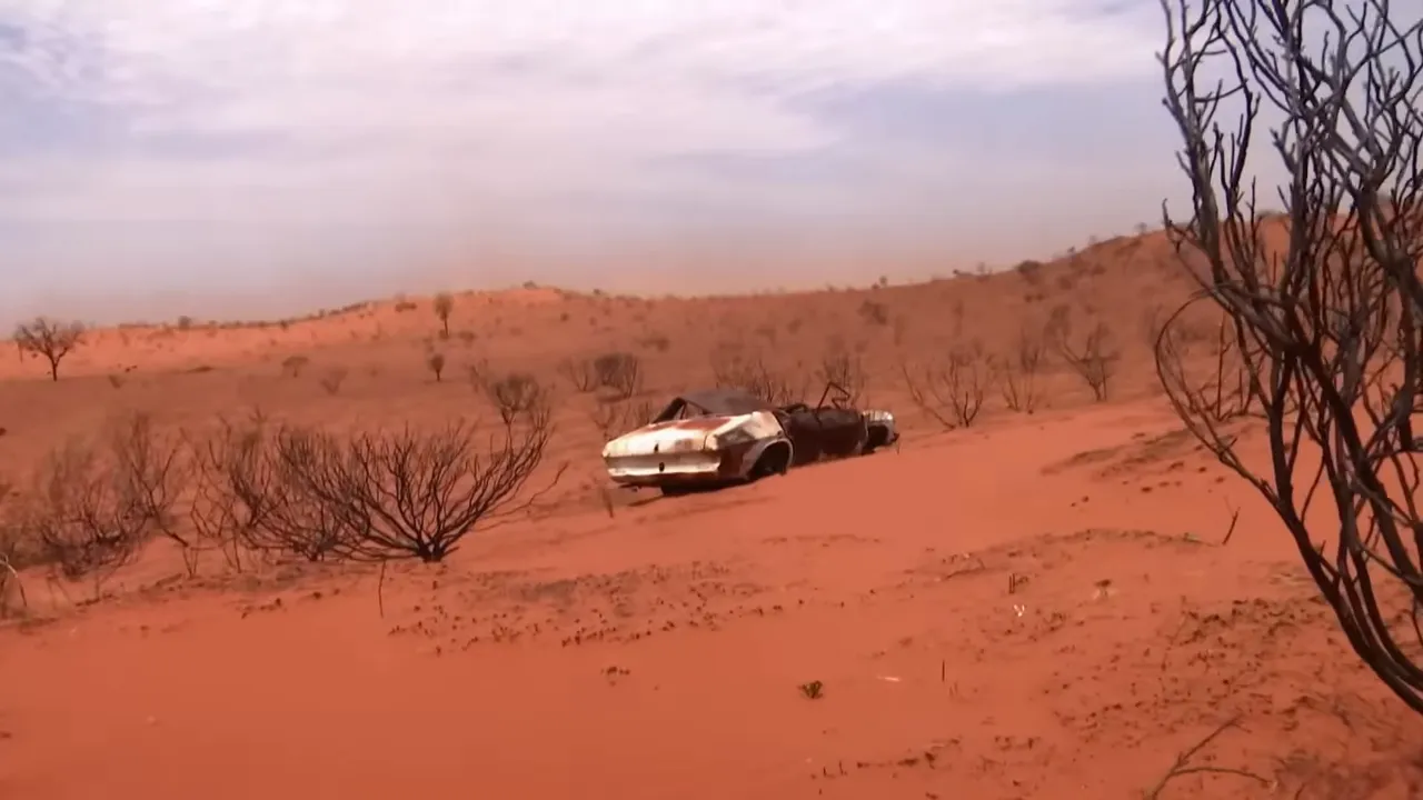 Loading damaged machinery on a makeshift ramp—remote site
