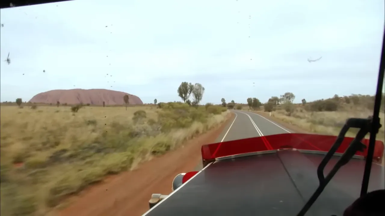 Uluru in the distance—Steve admits the distraction and missing a turn