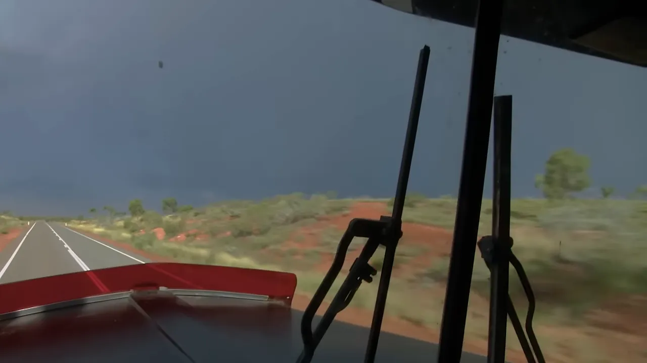 Storm clouds gather as Steve approaches the Tanami track