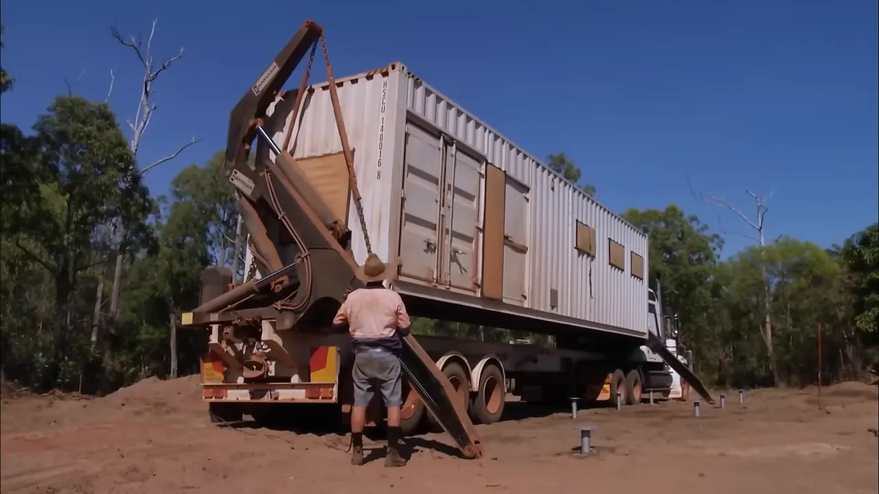 Crane unloading container onto the solar framework
