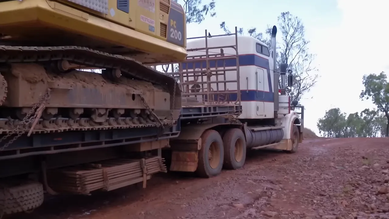 Excavator used as the recovery 'secret weapon' to right a slipping trailer