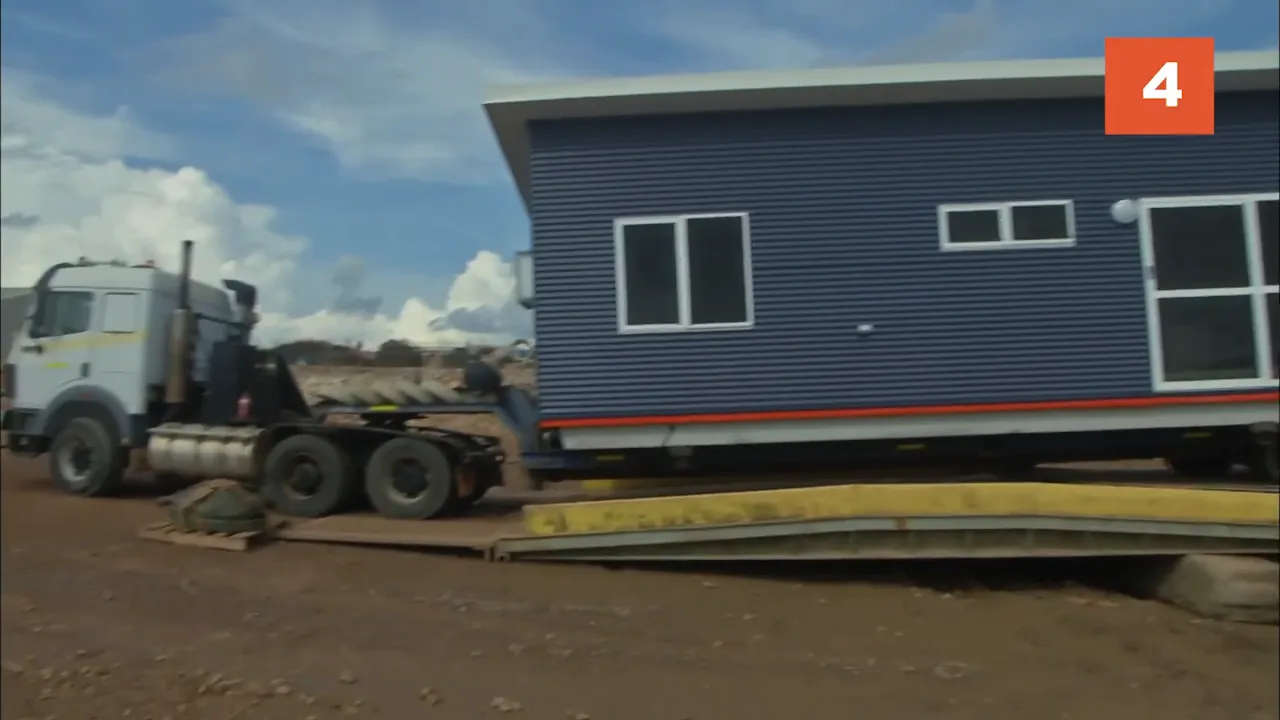 26-ton house loaded on barge for remote delivery