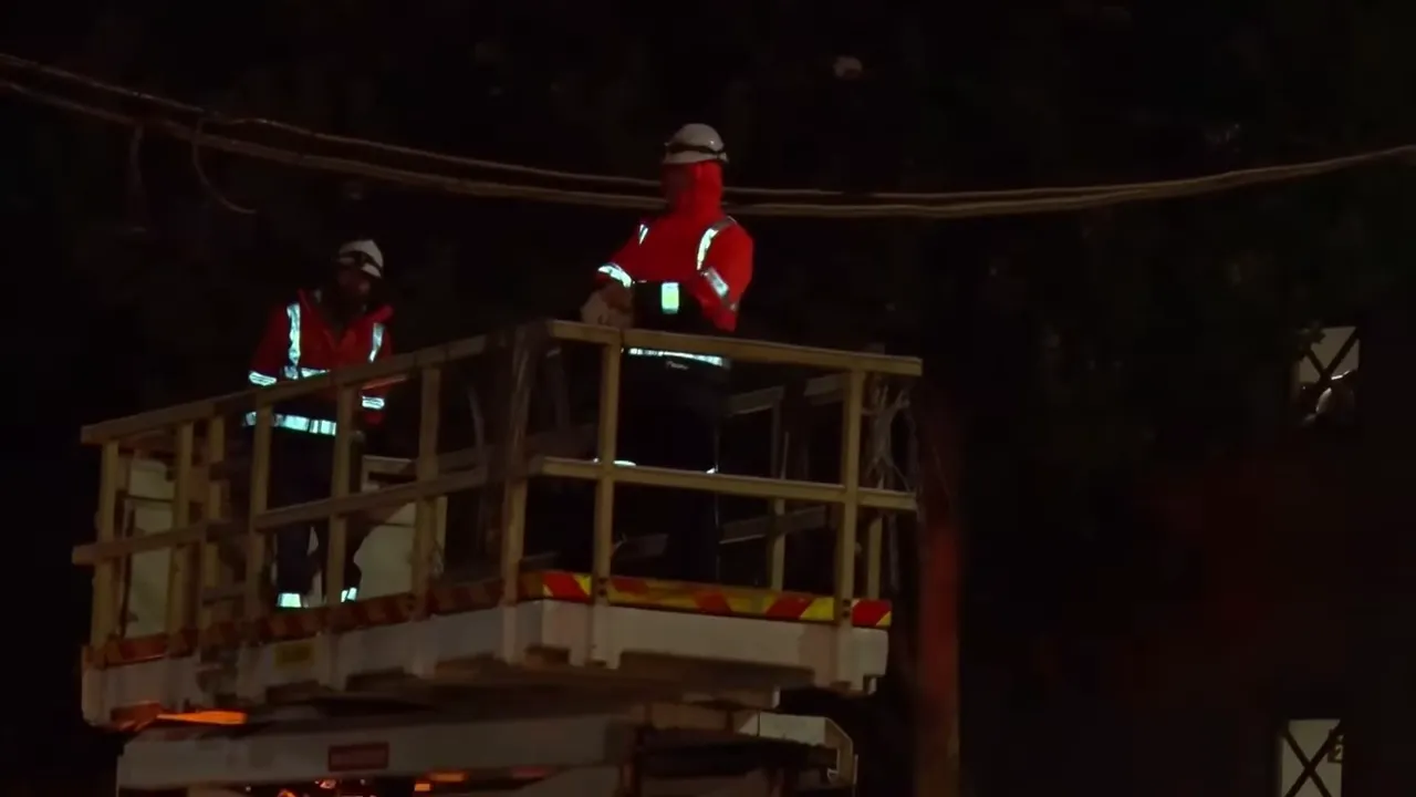 Tram crew working to lift overhead power lines