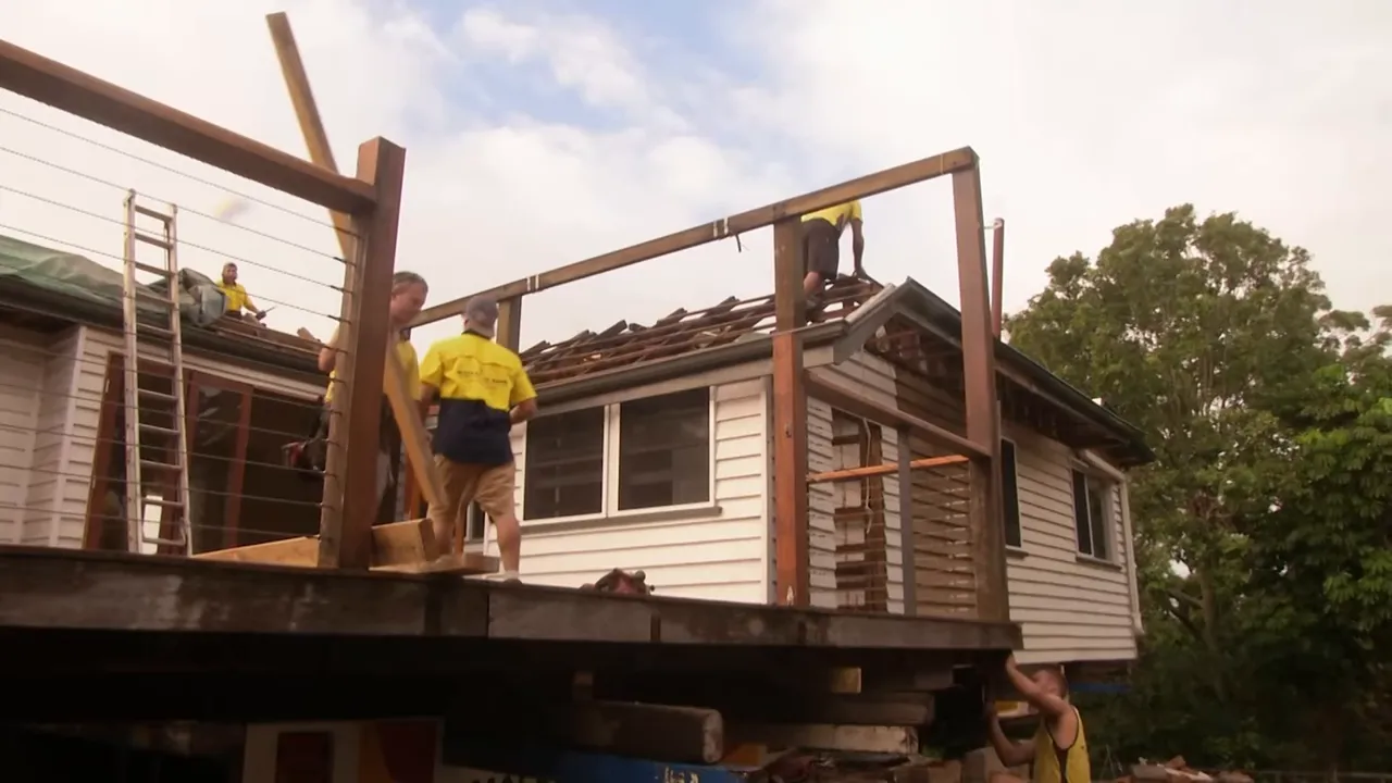 Crew preparing the house to be cut in half at the build site