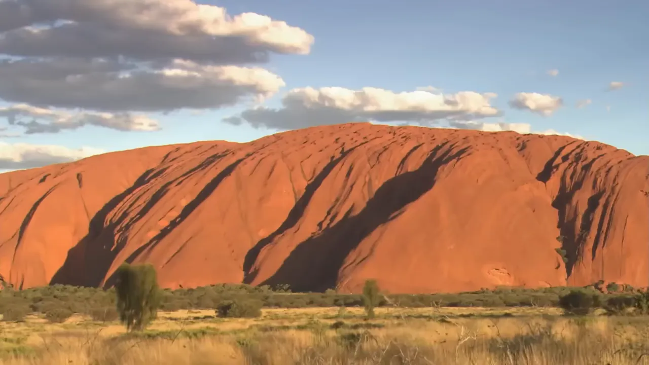 Deb at Ayers Rock — a well-earned detour
