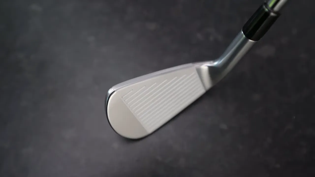Close-up of the Srixon ZXi5 Plus iron head on a dark background