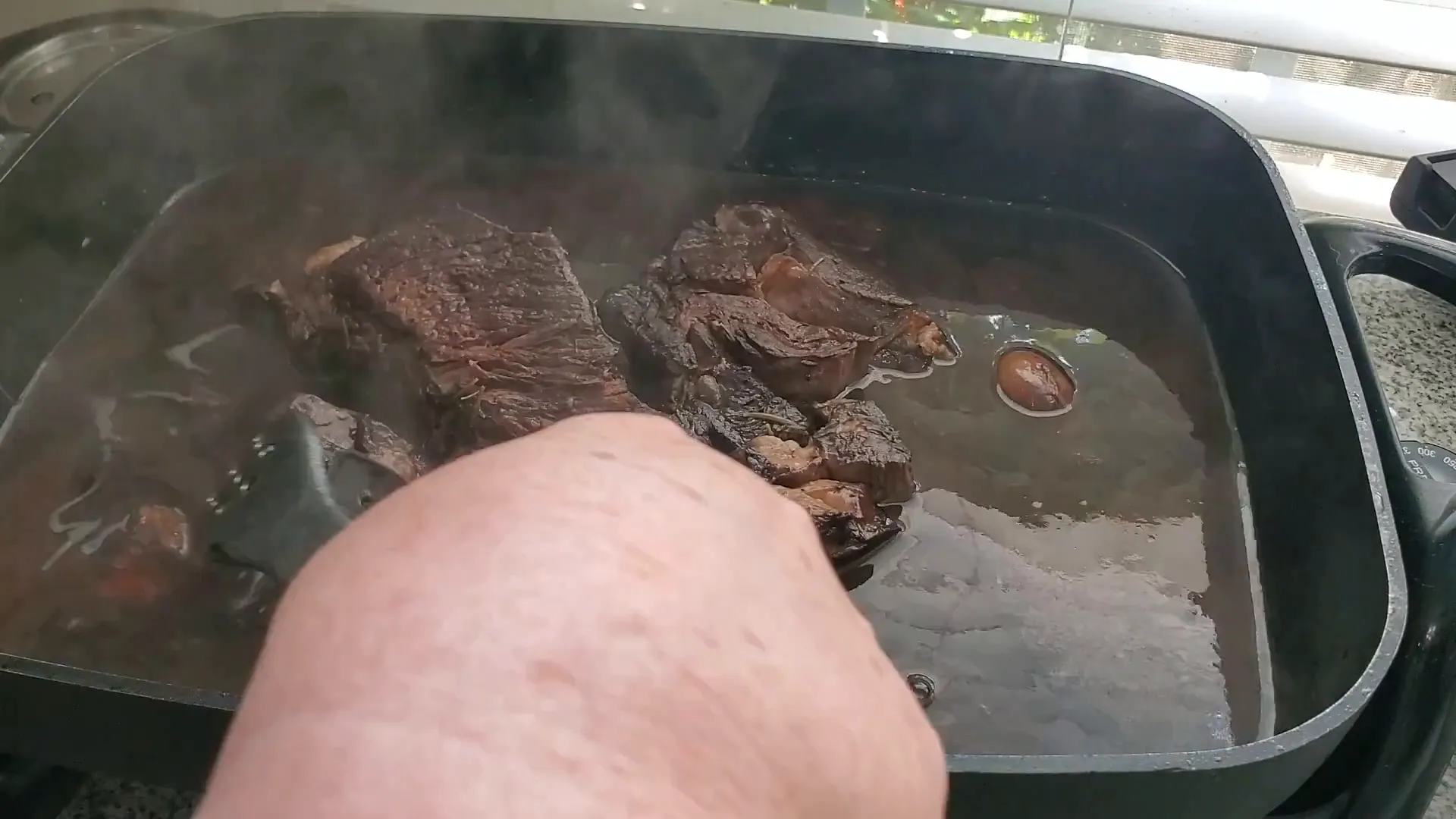 Reducing the braising liquid.