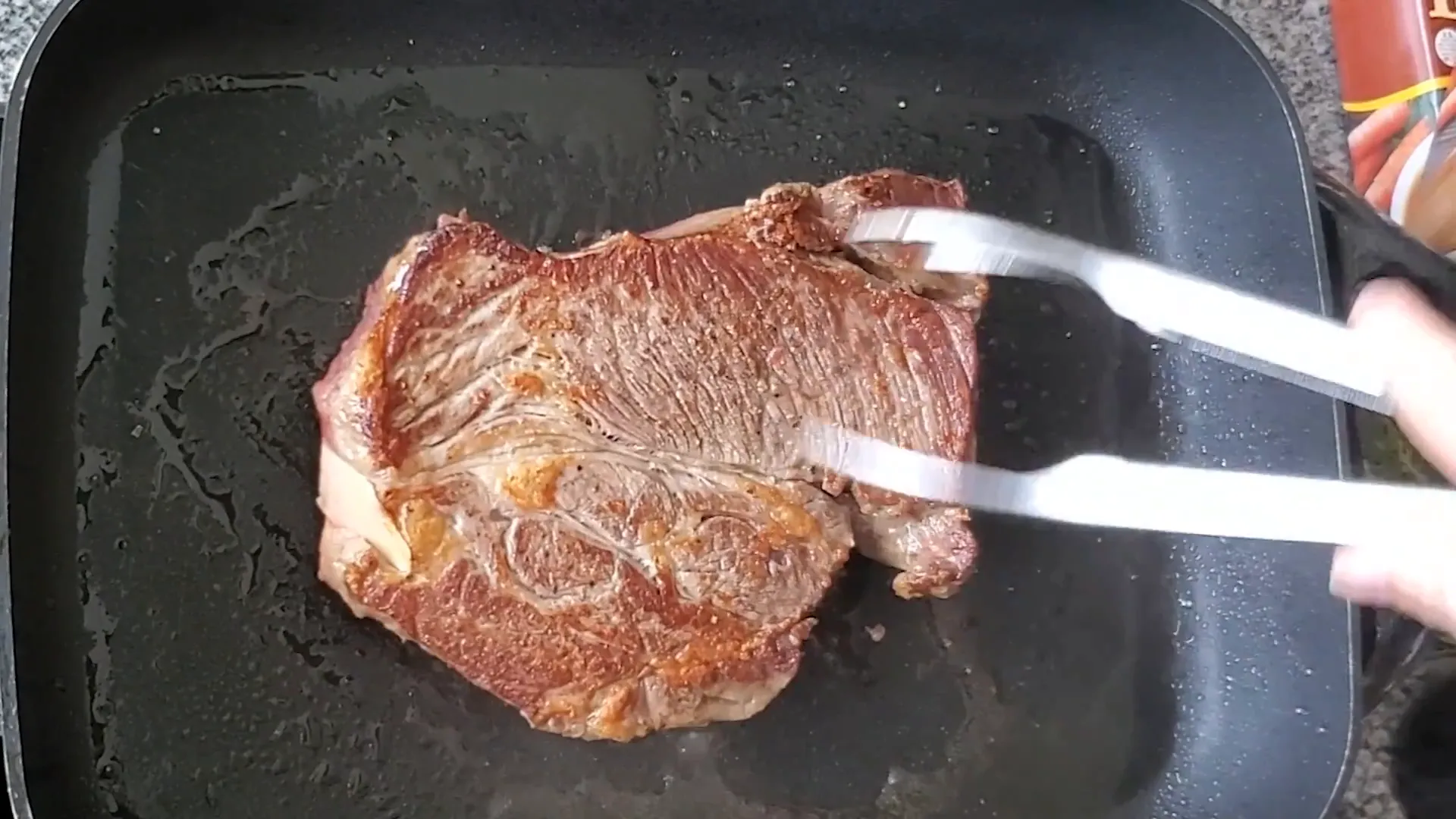 Searing the chuck roast to a nice brown.
