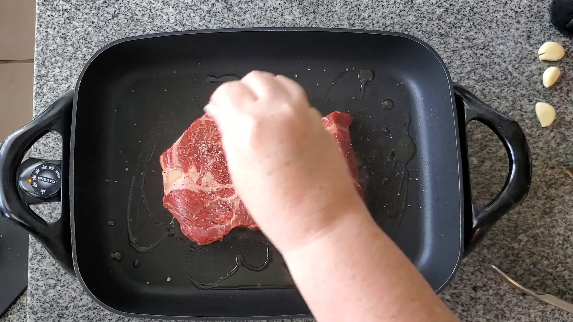 Heating olive oil in the skillet.