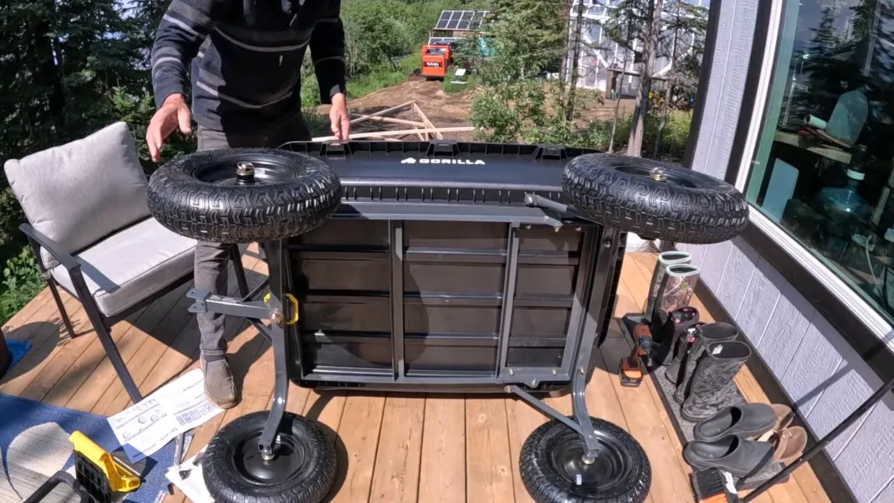Off grid life - assembled gorilla dump cart with large tires on the cabin deck
