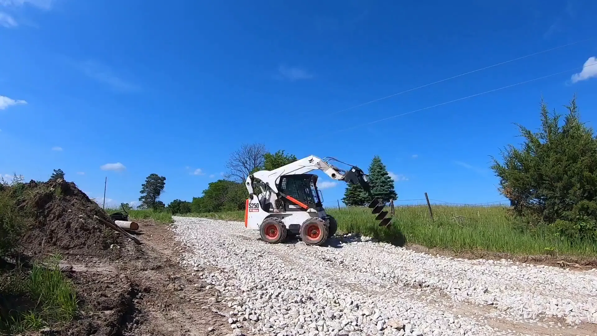 Attachments for Bobcat skid steer including buckets and posthole auger
