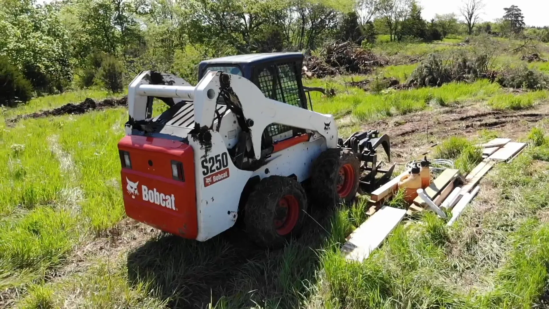 Bobcat S250 skid steer used for land clearing