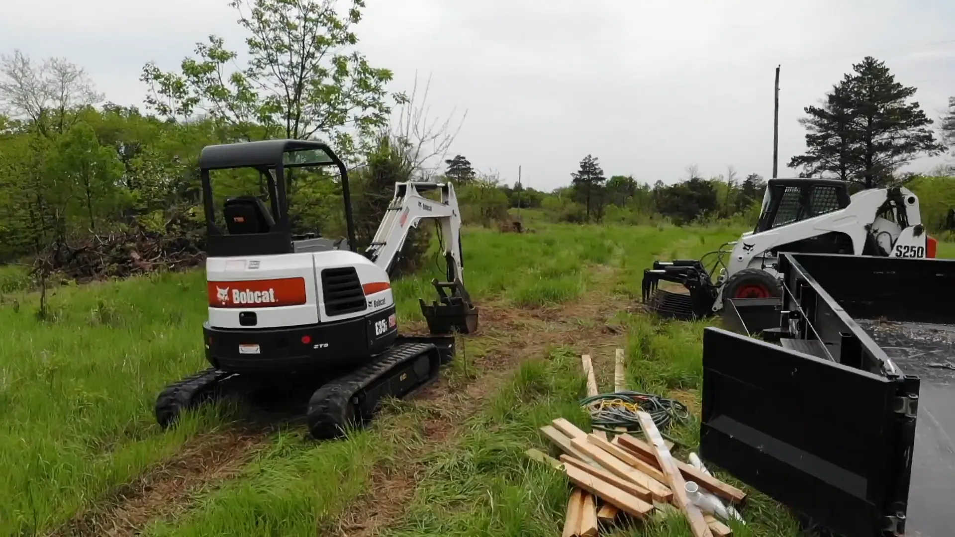 Small Bobcat excavator clearing land