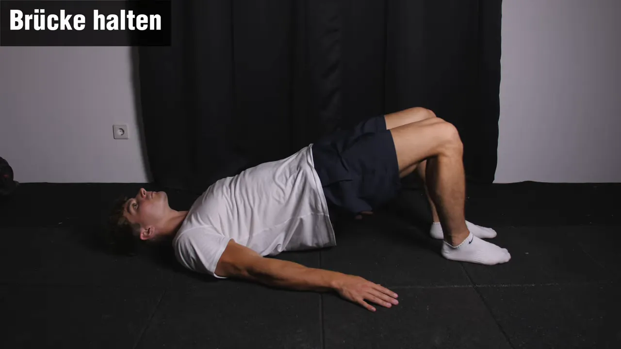 Person zeigt dynamische Brücke für Krafttraining bei Shin Splints