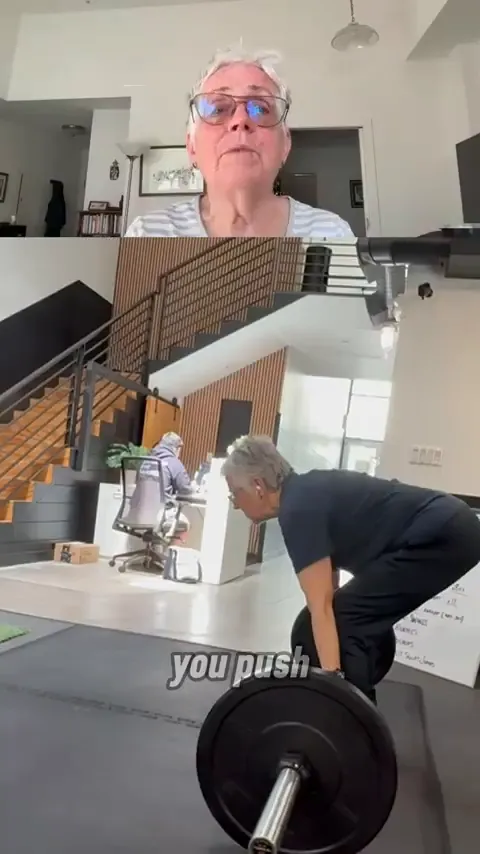 Coach reviewing a client's video for form feedback