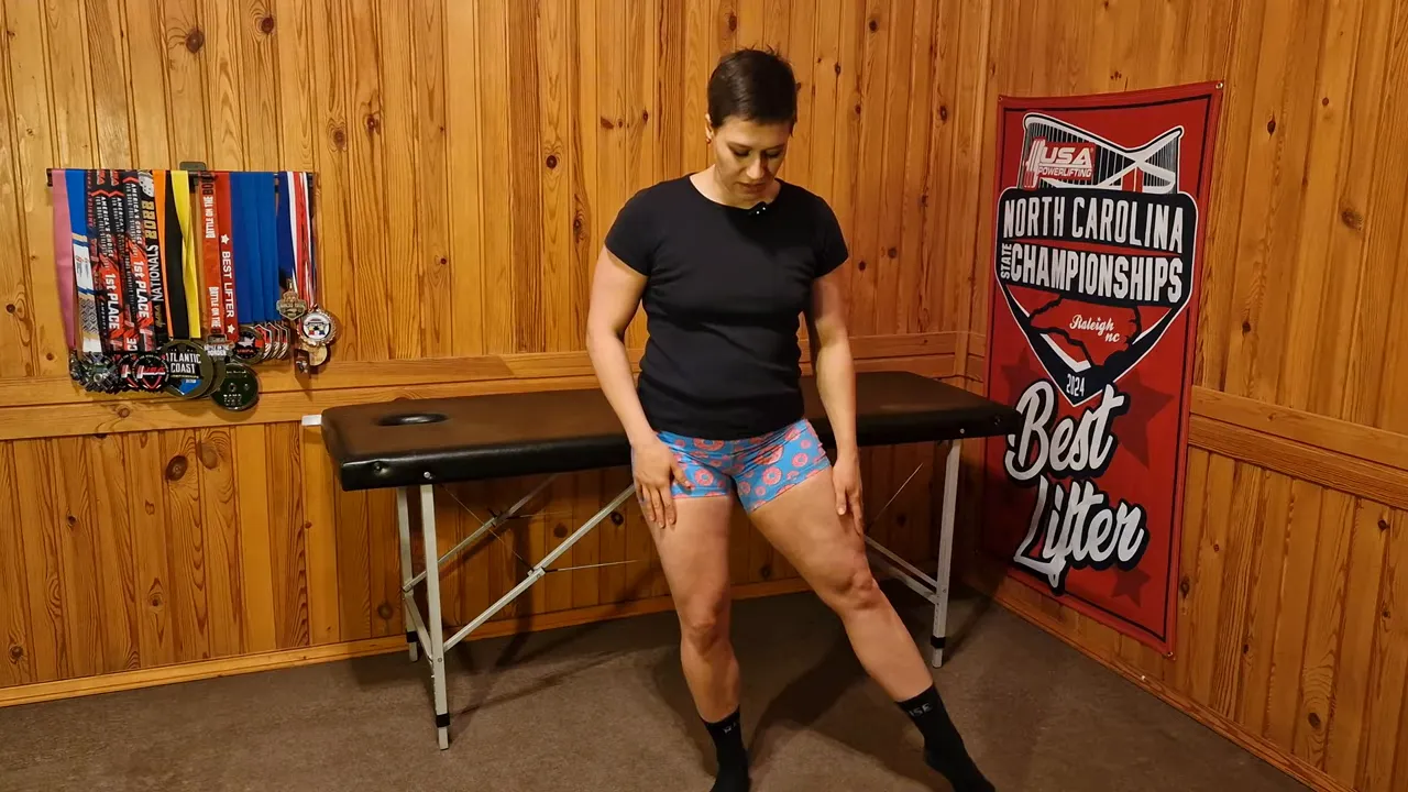 Instructor balancing on one leg and pointing the free leg to the side to show a clock position